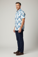 Model wearing blue floral shirt - side view